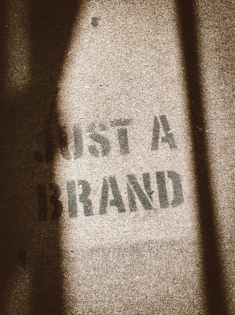 the shadow of a person standing in front of a sign